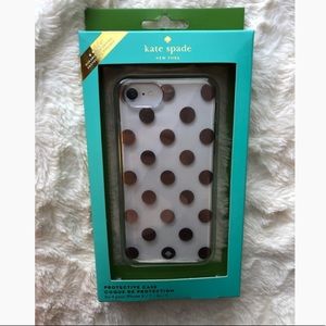 Clear Kate Spade case with gold polkadots